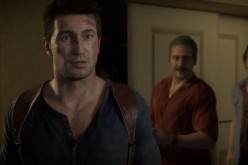 Lead protagonist Nathan Drake being led into a room by his abductors in 'Uncharted 4: A Thief's End.'