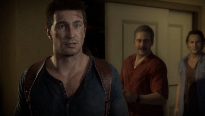Lead protagonist Nathan Drake being led into a room by his abductors in 'Uncharted 4: A Thief's End.'
