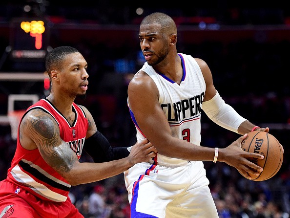 Damian Lillard of the Portland Trail Blazers guards Chris Paul of the LA Clippers during a 121-120 Clipper win at Staples Center on Dec. 12, 2016 in Los Angeles, California.