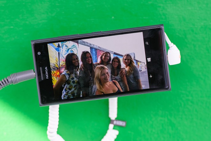  A picture of visitors seen on the Nokia Lumia 735 phone at the Nokia Lumia 735 Skype and Selfie Pod at the East Side Gallery on September 6, 2014 in Berlin, Germany. 