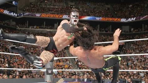 Finn Balor lands a heavy strike against Seth Rollins during their SummerSlam matchup for the inaugural WWE Universal Championship title.