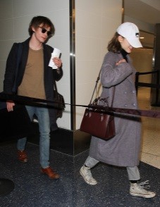 Natalia Dyer and Charlie Heaton are seen at LAX on January 09, 2017 in Los Angeles, California.