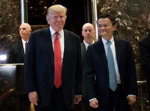 President-elect Donald Trump and Jack Ma, chairman of Alibaba Group, emerge from the elevators to speak to reporters following their meeting at Trump Tower, Jan. 9, 2017 in New York City.