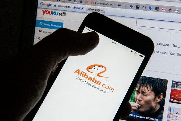 The Alibaba Group Holding Ltd. app logo is displayed on an Apple Inc. iPhone 6 smartphone screen.