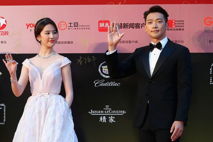 South Korea singer Rain (R), Chinese actress Crystal (L) arrive for the red carpet of the 17th Shanghai International Film Festival at Shanghai Grand Theatre on June 14, 2014 in Shanghai, China.