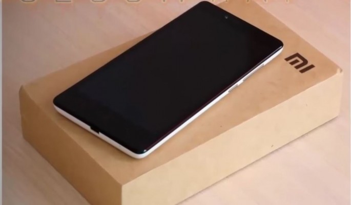 Xiaomi smartphone is placed on top a Mi box for display.