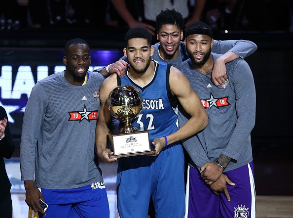  Karl-Anthony Towns of the Minnesota Timberwolves poses with the trophy and Draymond Green of the Golden State Warriors, Anthony Davis of the New Orleans Pelicans and DeMarcus Cousins of the Sacramento Kings after winning in the Taco Bell Skills Challenge