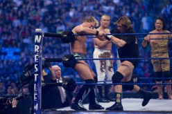 Jimmy Snuka (R) watches on from outside the ring with Ricky Steamboat as their teammate Roddy Piper strikes Chris Jericho during their handicap elimination match at WrestleMania 25 last April 5, 2009.