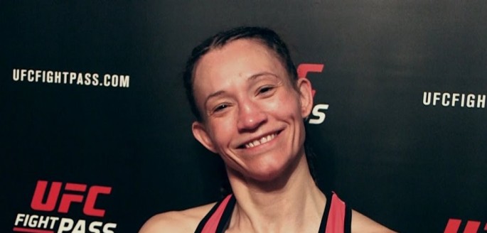 Amy Montenegro smiles for the cameras during her Invicta 21 post-fight interview last Jan. 14 at the Sottish Rite Temple in Kansas City, Missouri.