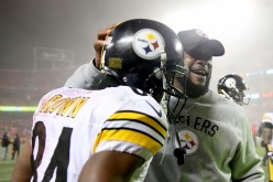 Pittsburgh Steelers wide receiver Antonio Brown celebrates with coach Mike Tomlin after their victory over the Kansas City Chiefs last Jan. 15.