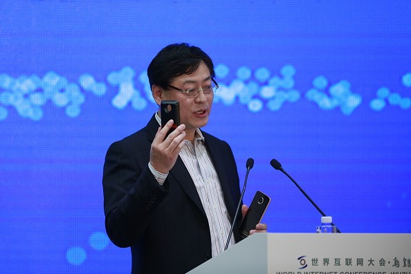 Yang Yuanqing, chairman and CEO of Lenovo Group Ltd, speaks on 'Man meets machine: Smart Internet opens a world of possibilities" during a forum.
