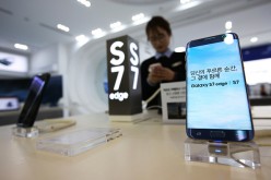 A Samsung Electronics Co. Galaxy S7 Edge smartphones is displayed at the company's Galaxy Zone store in the COEX mall in Seoul, South Korea, on Wednesday, Jan. 4, 2017.