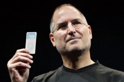 The late Apple Inc. co-founder Steve Jobs holds an iPod.