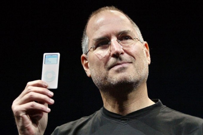 The late Apple Inc. co-founder Steve Jobs holds an iPod.