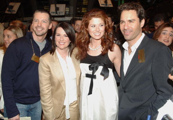 (L-R) Sean Hayes, Megan Mullally, Debra Messing, and Eric McCormack from the Cast of 'Will and Grace' walk on the floor of the New York Stock Exchange on May 18, 2006 in New York City.   