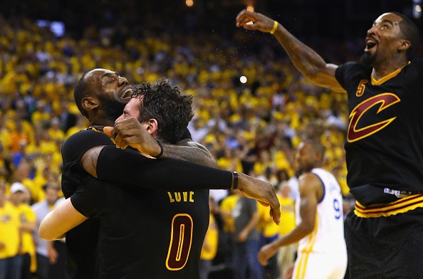 LeBron James, Kevin Love, and J.R. Smith of the Cleveland Cavaliers celebrate after defeating the Golden State Warriors 93-89 in Game 7 of the 2016 NBA Finals at ORACLE Arena on June 19, 2016 in Oakland, California.
