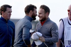 Tyrrell Hatton is congratulated by his playing partner Jamie Dornan after finishing their round on the 18th green during the third round of the Alfred Dunhill Links Championship at The Old Course in St Andrews, Scotland. 
