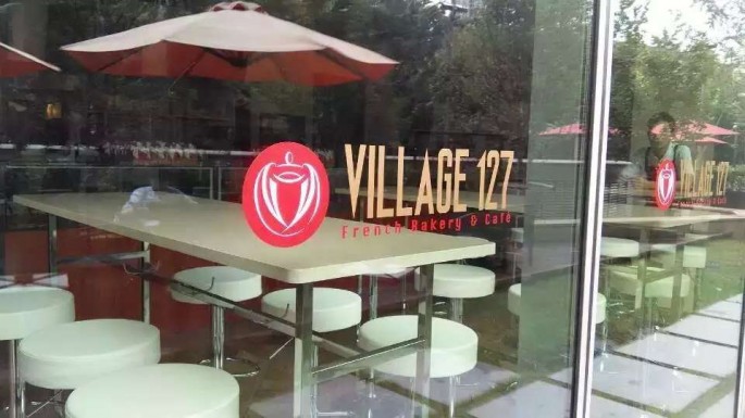 The facade of Village 127 French Bakery and Cafe 