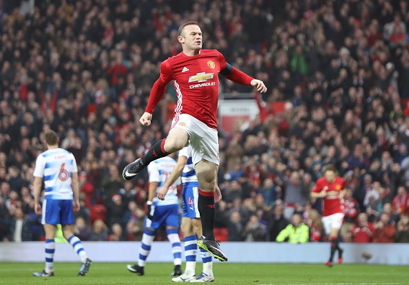 Even with a chance to earn an absurd amount of money in China, Wayne Rooney insists he is happy with Manchester United.