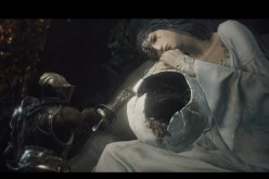 A 'Dark Souls III' character tries to touch the crumbling sphere sitting on the woman's lap.