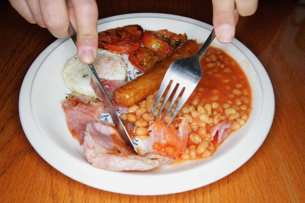 In this photo illustration an all English fry up breakfast is eaten