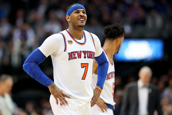 Carmelo Anthony of the New York Knicks reacts against the Dallas Mavericks in the second half at American Airlines Center on January 25, 2017 in Dallas, Texas.