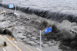 A tsunami generated by the 2011 Tōhoku earthquake and tsunami strikes Japan.           