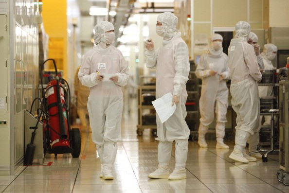 Employees operate at Semiconductor Manufacturing International Corp. (SMIC) in Shanghai.