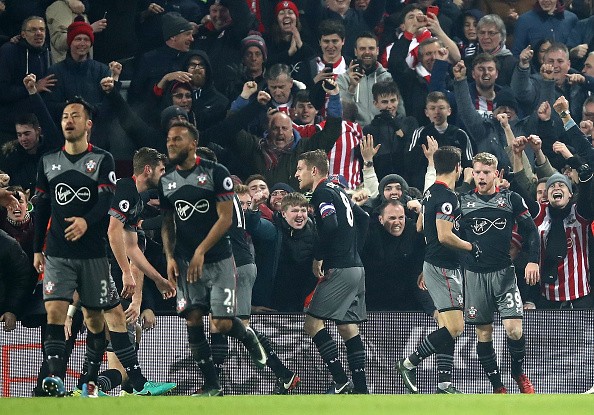 Players of Southampton FC celebrate after a goal.