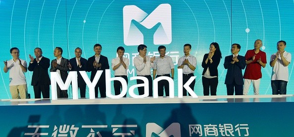 Jack Ma (6th, left), chairman of Alibaba Group Holding Ltd., attends the opening ceremony of Alibaba-backed Internet bank MYbank in Hangzhou, China.