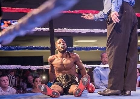 Roshaun Jones on the canvas after being knocked down by Cande Rochin in a boxing match last July 18, 2015.
