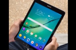 A Samsung tablet, not the Galaxy Tab S3, is held by its user while displaying some of its features. 