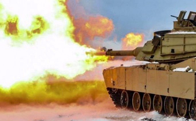 An M1A2 Abrams main battle tank of the U.S. Army 3rd Armored Brigade Combat Team now deployed to Poland fires its 120 mm gun.                     