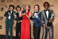 Actors Finn Wolfhard, Gaten Matarazzo, Millie Bobby Brown, Noah Schapp and Caleb McLaughlin, winners of the Outstanding Ensemble in a Drama Series award for 'Stranger Things', pose in the press room during the 23rd Annual Screen Actors Guild Awards at The