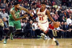 Jimmy Butler of the Chicago Bulls drives to the basket against Amir Johnson of the Boston Celtics during the second half of a game at the United Center on October 27, 2016 in Chicago, Illinois.