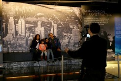 Visitors pose for a photo at the Rockefeller Center in New York, United States.