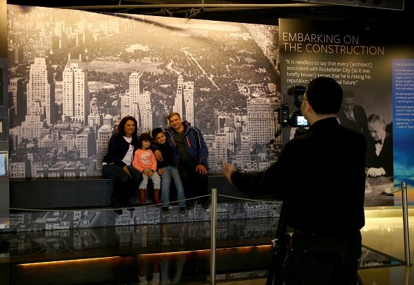 Visitors pose for a photo at the Rockefeller Center in New York, United States.