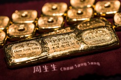 Gold bars of five taels and one tael are arranged for a photograph inside a Chow Sang Sang Holdings International Ltd. jewelry store in Hong Kong.