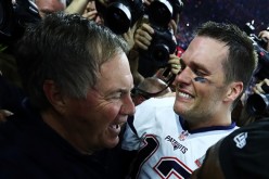 Tom Brady #12 and head coach Bill Belichick of the New England Patriots