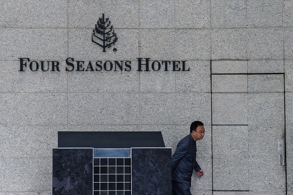 A man walks past the hotel where Chinese billionaire Xiao Jianhua was reportedly abducted by mainland security agents last month. 