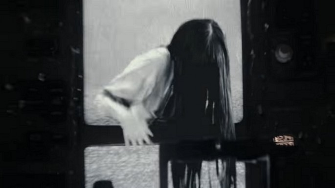Samara crawls out of an airplane television screen in 'Rings.'