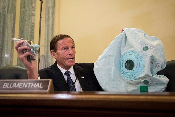 U.S. Sen. Richard Blumenthal holds up an airbag and inflator during a hearing on the recalls of defective Takata air bags.
