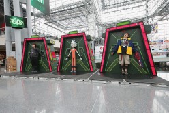 Fans pose for photos in the 'Rick and Morty' Galactic Federation Prison at at New York Comic Con on October 8, 2016 in New York City.