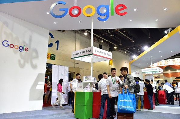 Visitors gathering at a Google booth during the 2016 China International Electronic Commerce Expo in Yiwu, east China's Zhejiang Province.