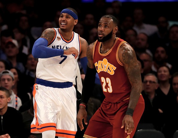 Carmelo Anthony of the New York Knicks and LeBron James of the Cleveland Cavaliers fight for position in the first quarter at Madison Square Garden on December 7, 2016 in New York City.