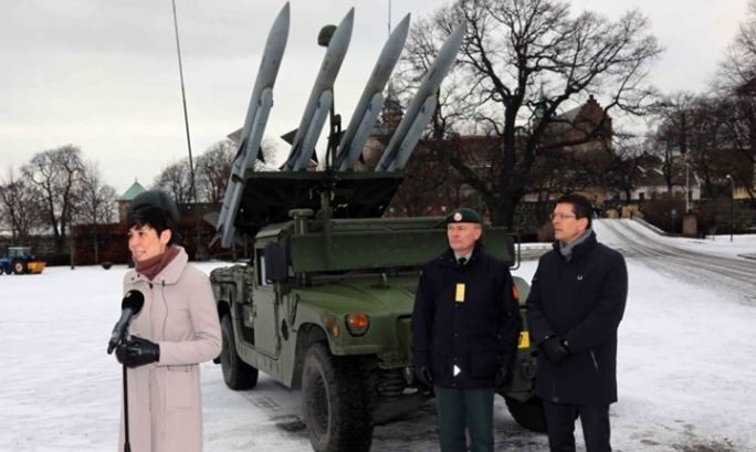 Noregian defense minister Ine Eriksen Søreide with the Norwegian Army's new Kongsberg air defense missile battery.               