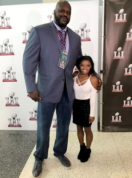 7'1" Shaquille O' Neal stands next to 4'8" Simone Biles during the proceedings of Super Bowl LI.