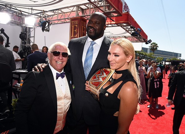Raw women's champion Charlotte poses with her father, WWE Hall of Famer Ric Flair, and NBA legend Shaquille O' Neal at the 2016 ESPY Awards.
