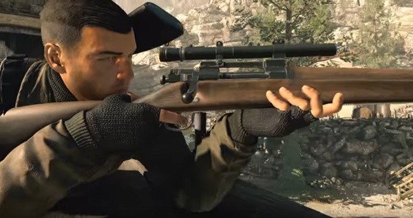 "Sniper Elite 4's" protagonist takes aim at an enemy at the far side of the terrain.