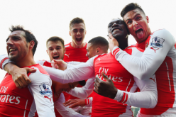 Members of the Arsenal squad celebrate during their match against West Bromich Albion in the Premier League.